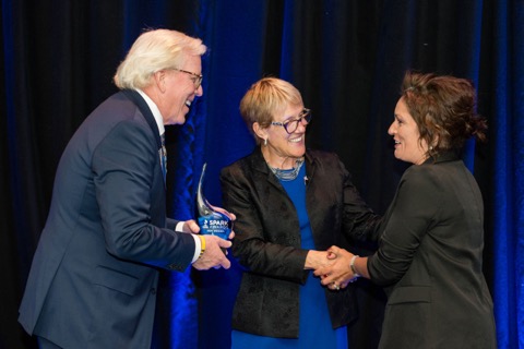 Angie accepting the Spark Award. This award is a testament to our dedication, integrity, and passion for serving our seniors with care and compassion.