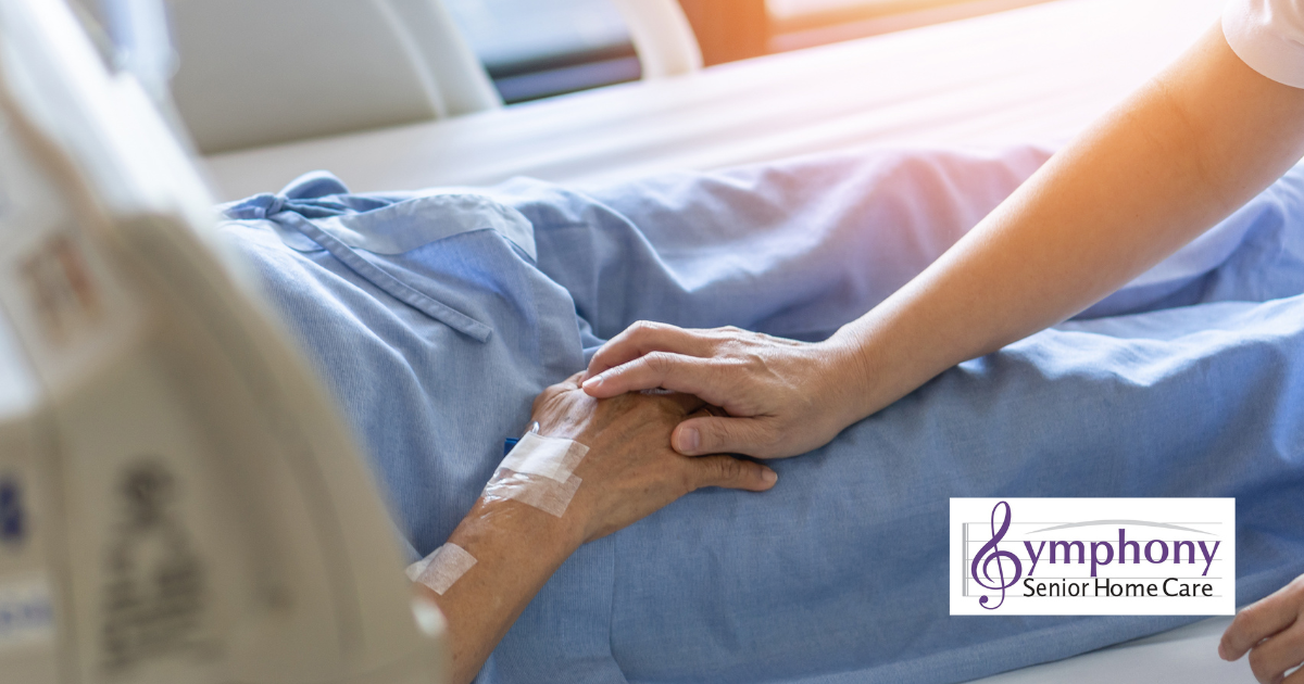 A hospice patient resting in a hospital-style bed holding hands with a caregiver, symbolizing comfort and compassionate hospice care at home