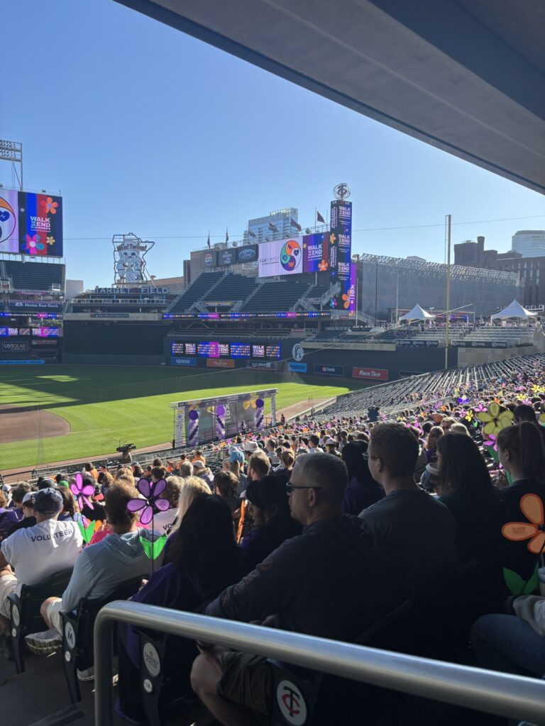 Symphony Senior Home Care team walking at the Alzheimer’s Walk MN 2025 at Minnesota Twins Stadium, raising awareness for Alzheimer’s support and research.