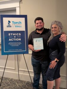 Symphony Senior Home Care team members Angie Wold and Dimitri at BBB Torch Award event