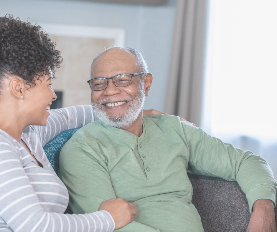 Adult daughter and senior father discuss home care versus assisted living options in Minnesota